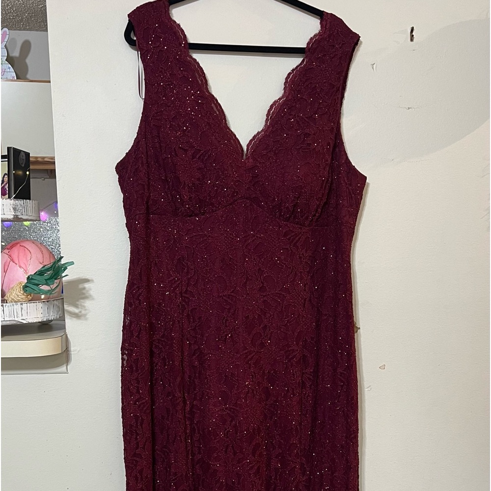 Wedding dress or party. the color is maroon. size W 22 .maxi, stretch,like new.